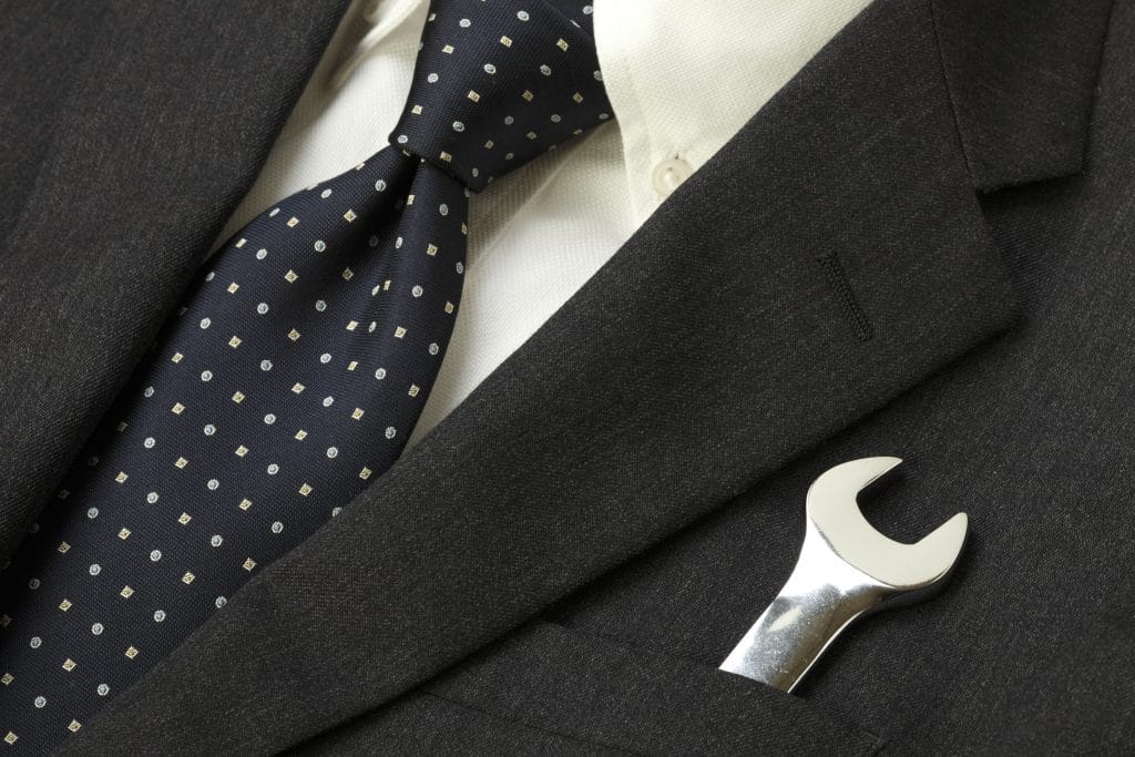 man in suit with wrench in pocket CMOE leadership