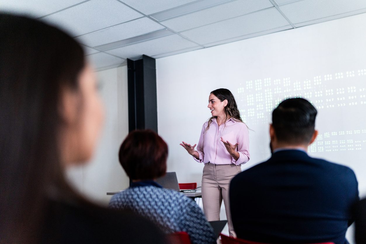 woman leading a business presentation