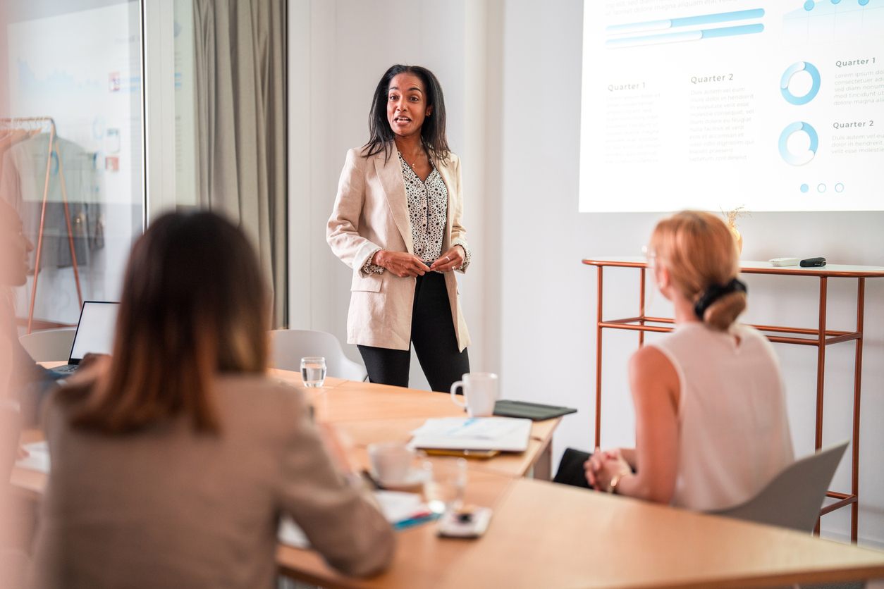 Successful Multiracial Female Leading A Business Meeting