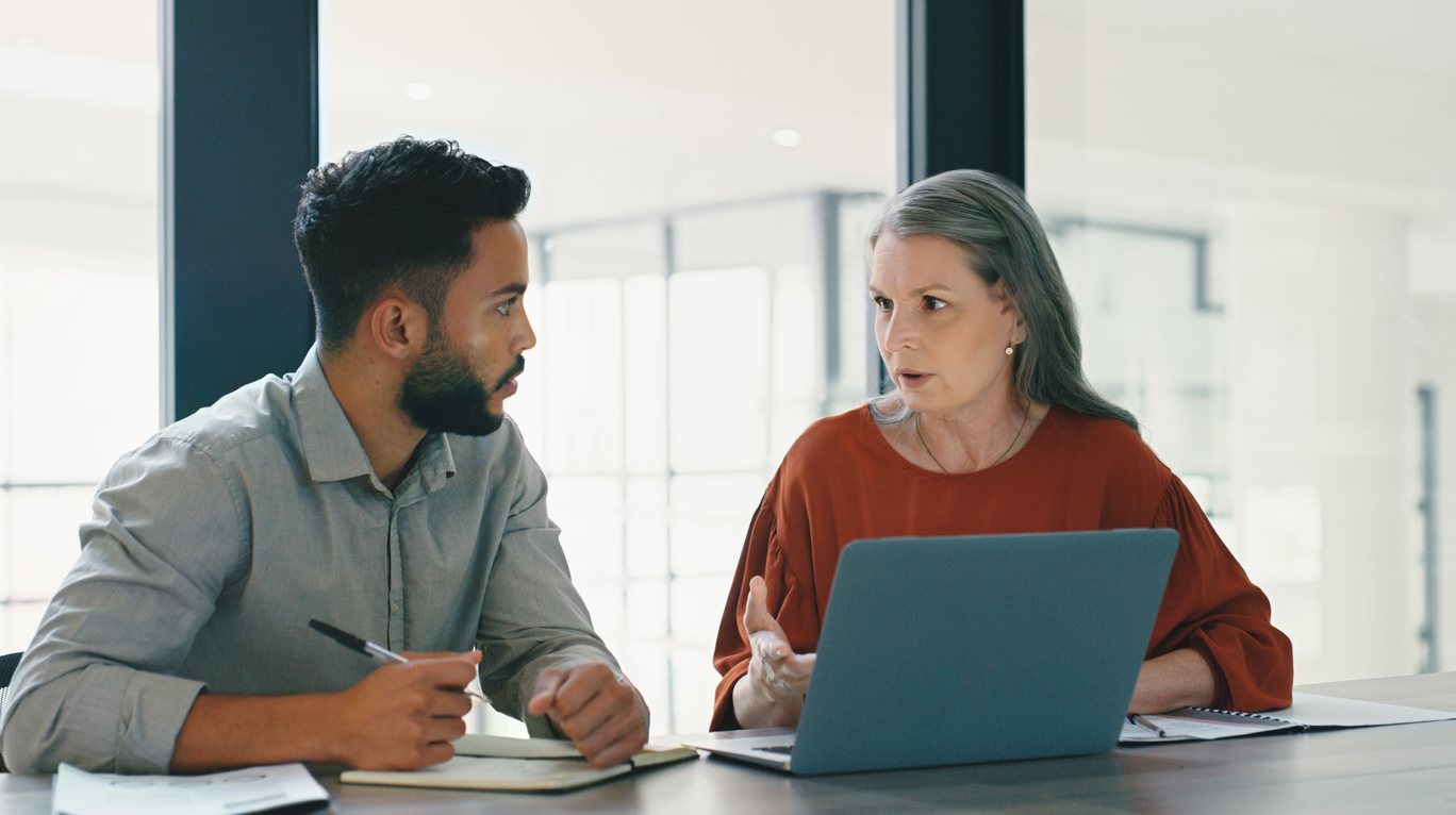 manager and leader in discussion at work