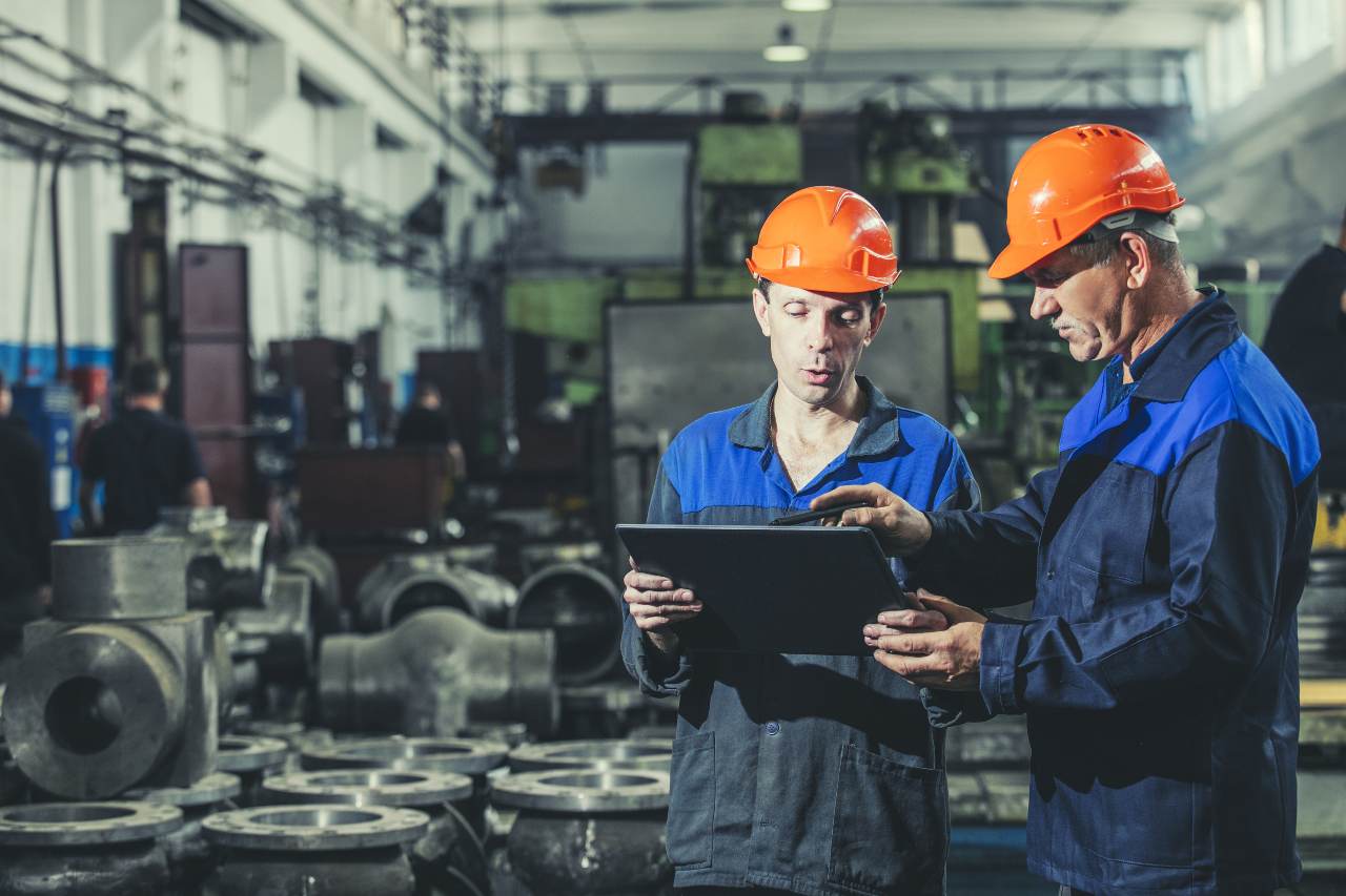 supervisors discussing over tablet