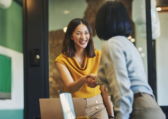 women shaking hands