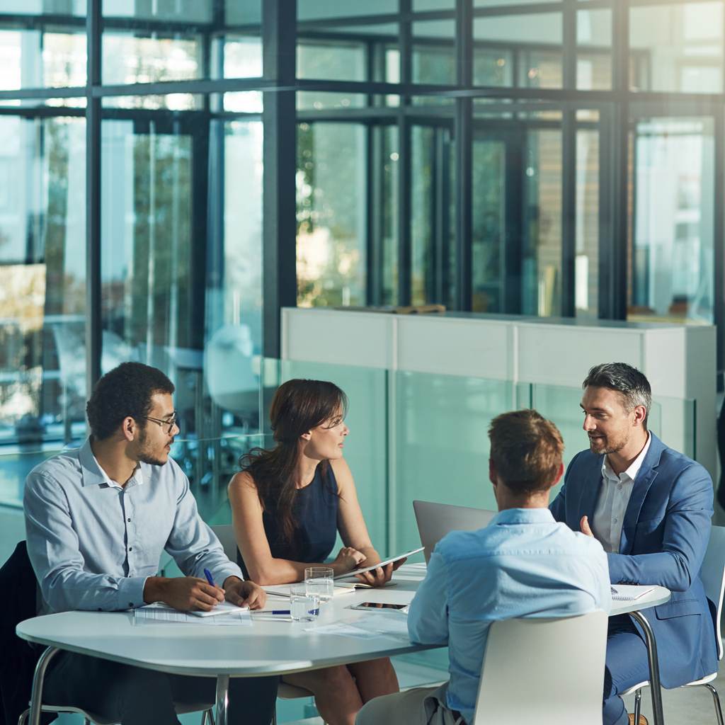 team around an office table