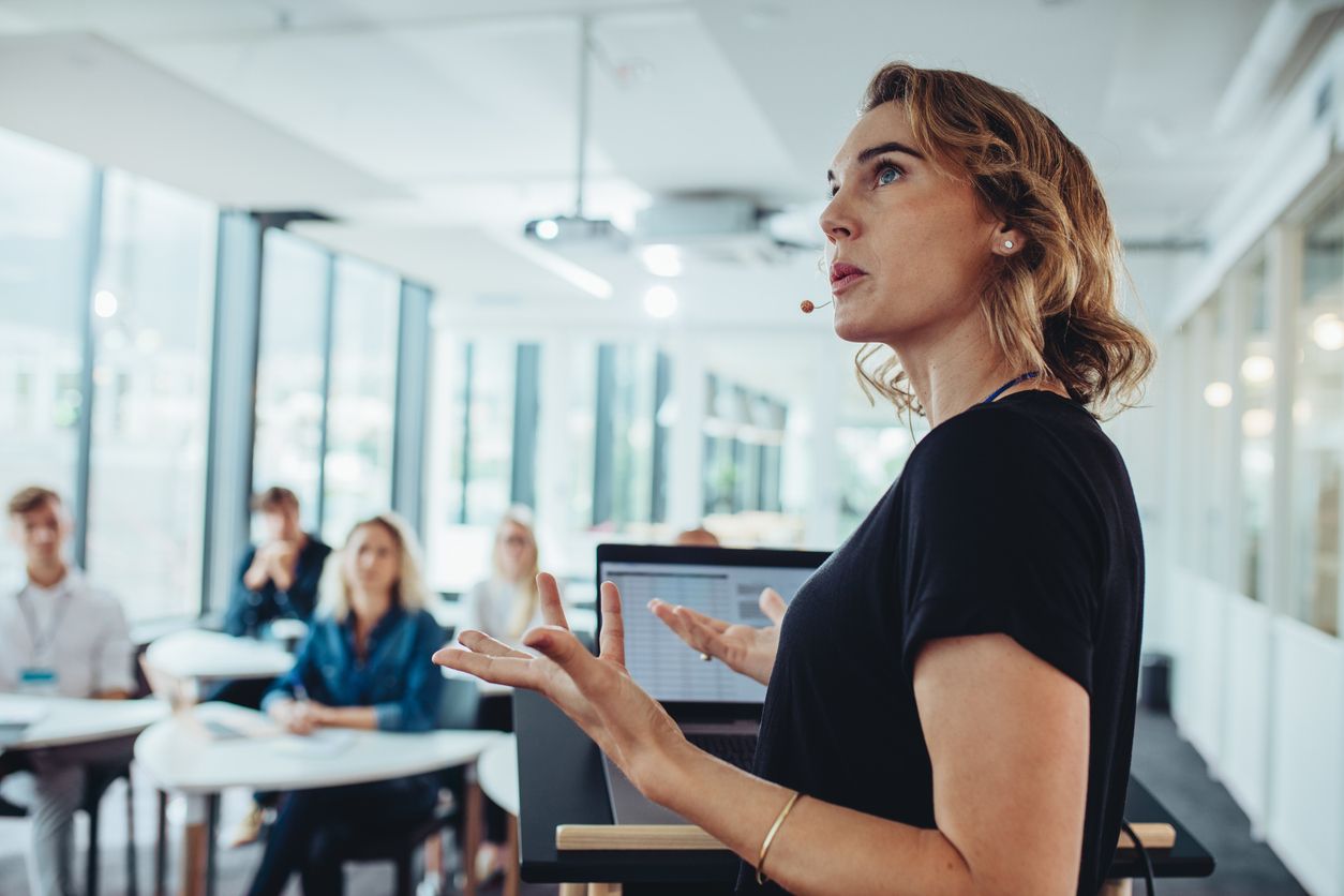 woman giving a presentation in conference room